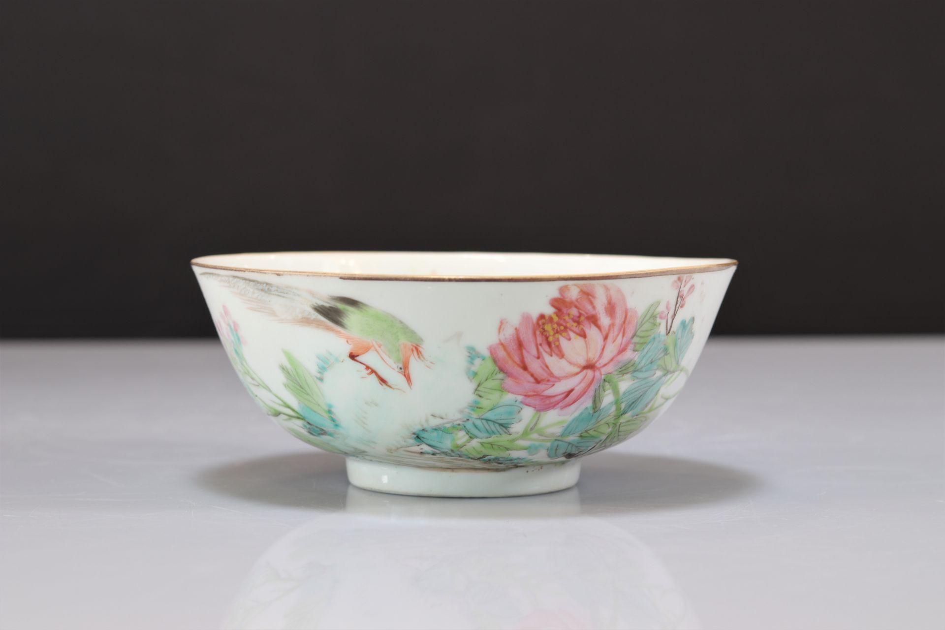 Large porcelain bowl decorated with artist signature birds