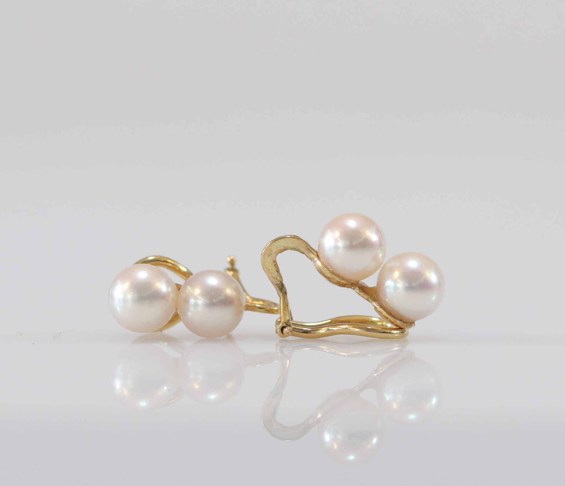 Pair of yellow gold and pearl earrings