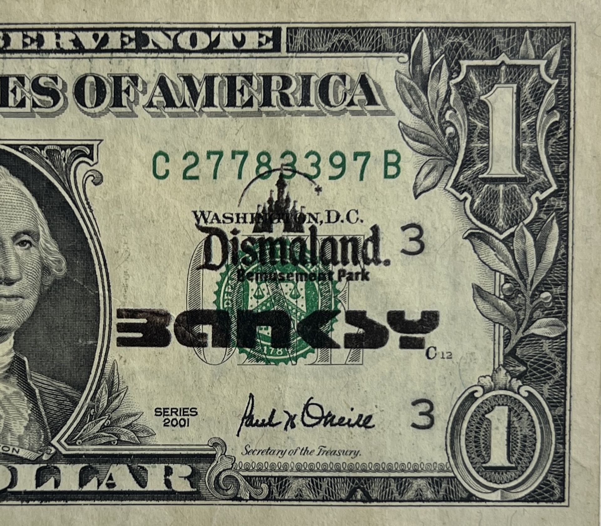 Banksy. â€œBomb Monkeyâ€. 2015. Ink stencil on a real one dollar banknote from â€œThe United States - Image 3 of 4