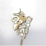 Arman Fernandez. Accumulation of keys. Silver and gold metal pendant. Signed "Arman" on the front. M