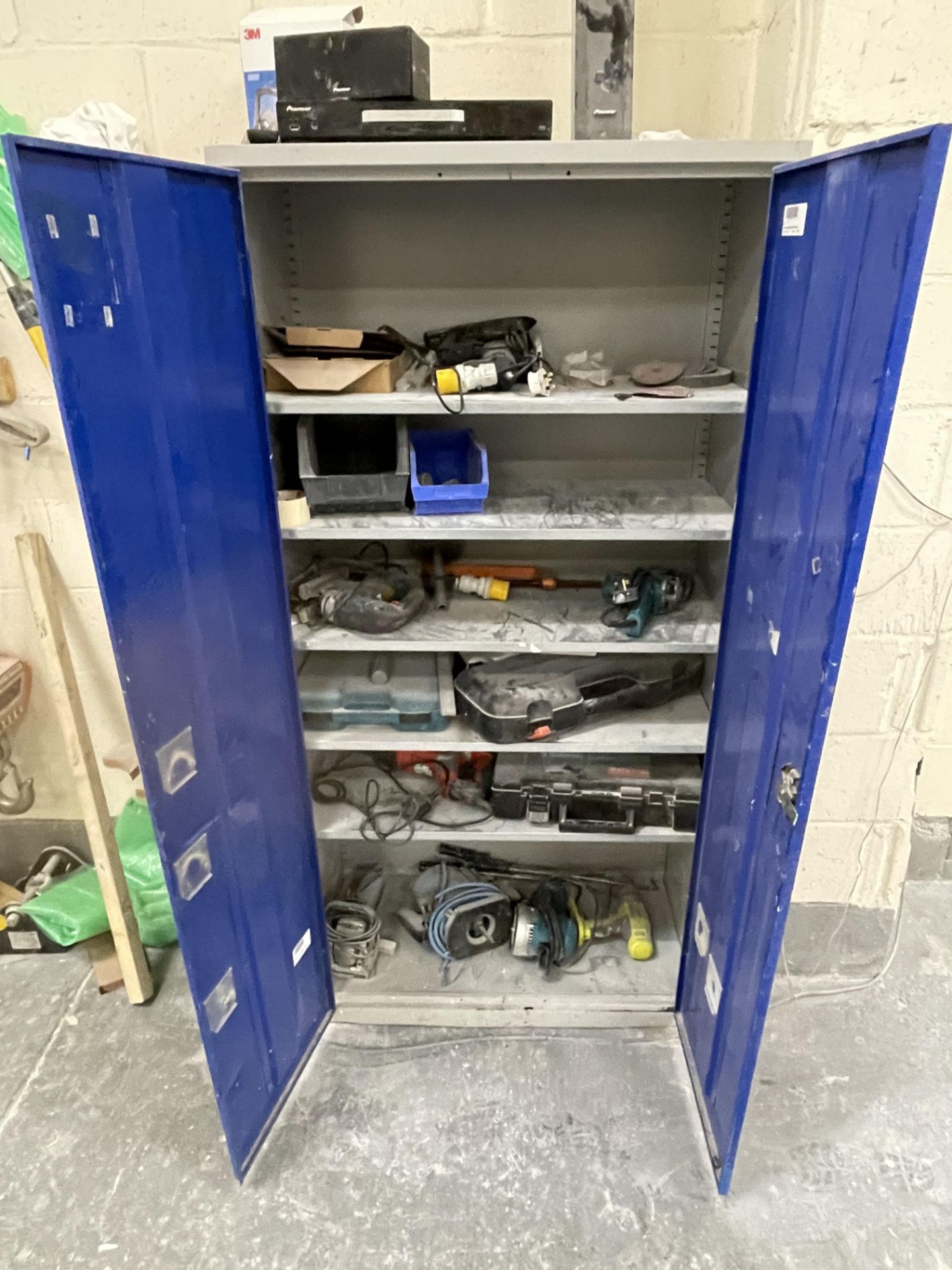 2 Door Cabinet and Contents to Erbauer Router, Makita Sander and other Various Powertools