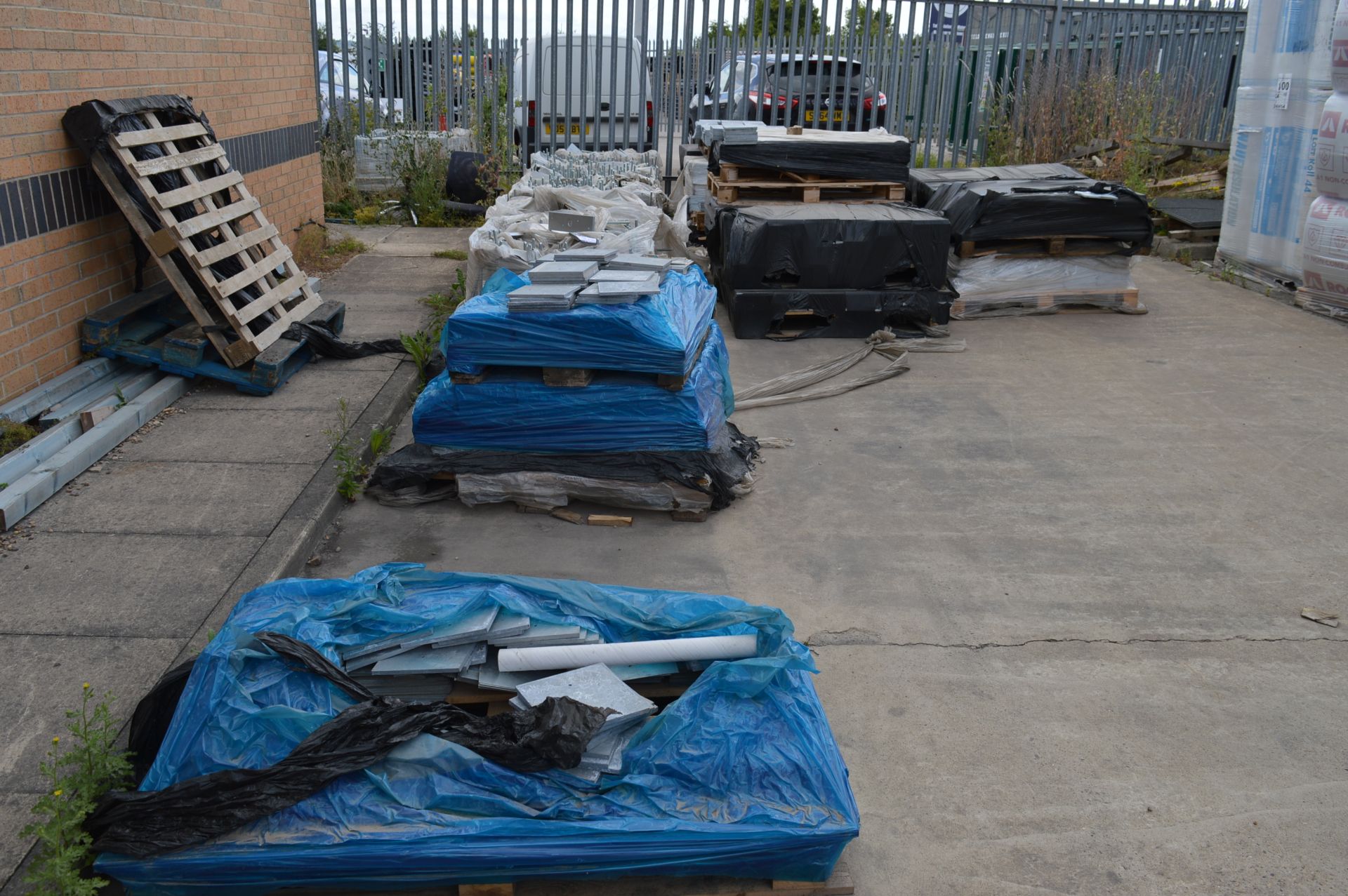 Quantity of galvanised steel fixing plates, bolts, etc. plus steel tubing, alloy window sills and 2x