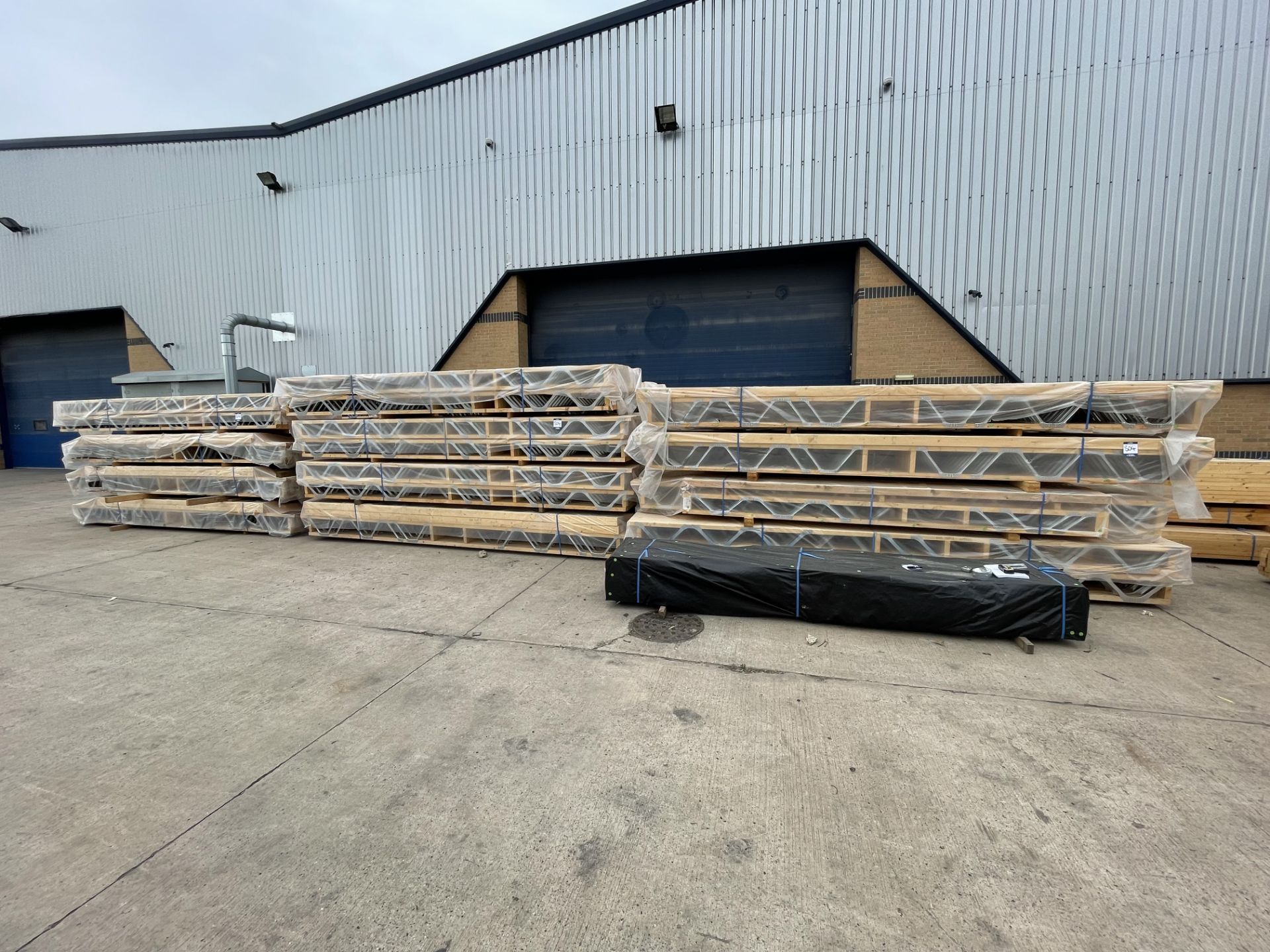 Large Quantity of Various Size Bracketed Timber Truss Beams