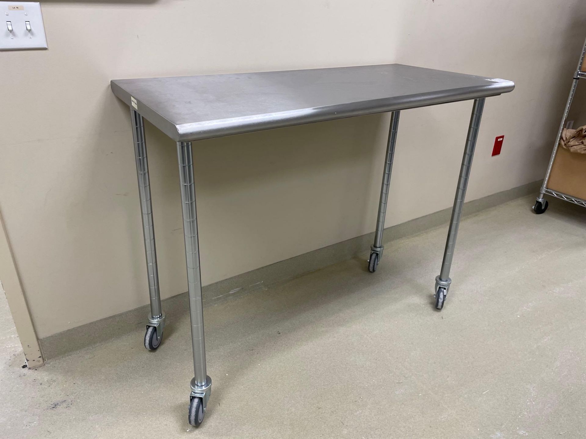 Stainless Top Table w/ Wire Shelf Legs on Casters