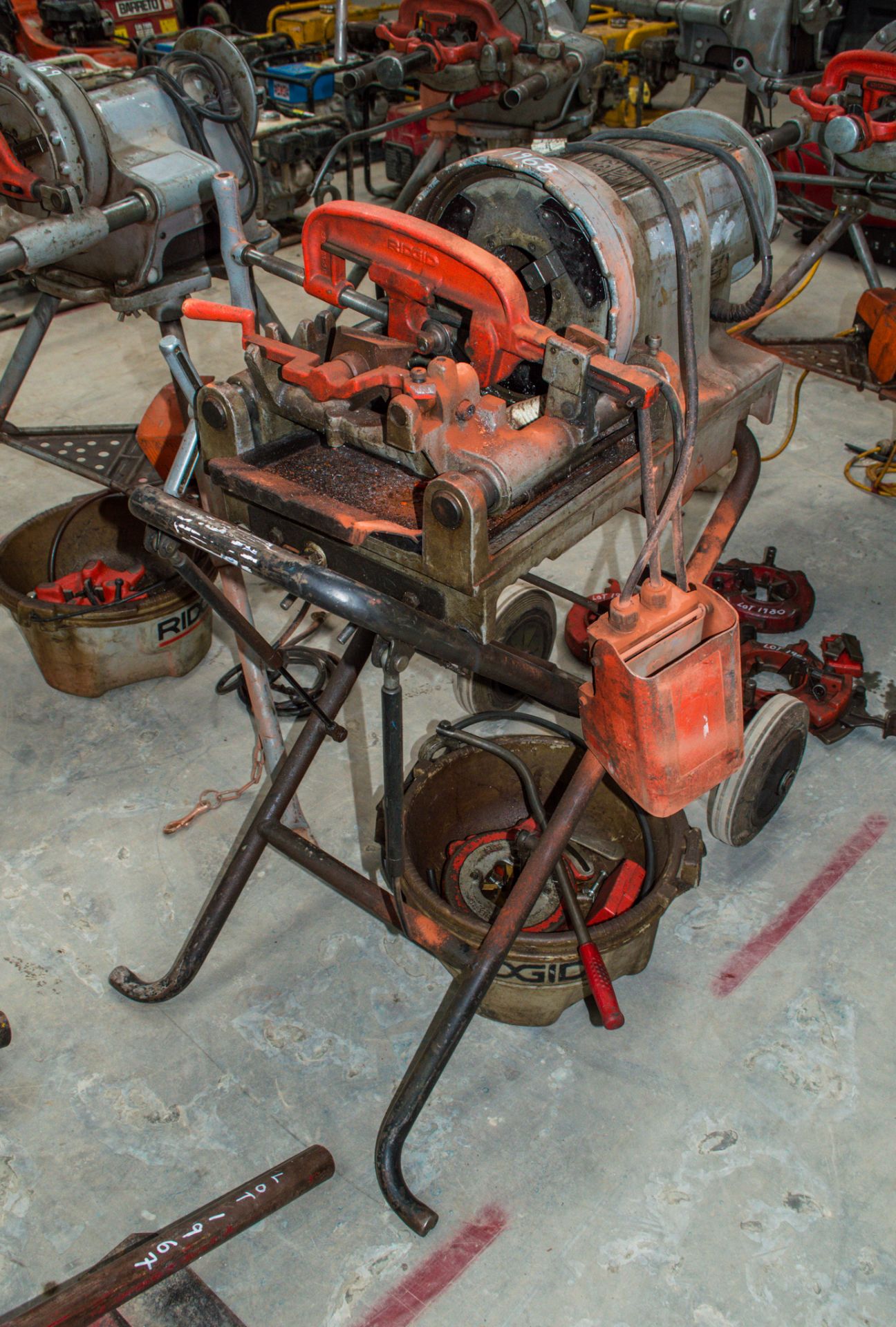 Ridgid 1233 110 volt pipe threading machine c/w stand, oil bucket, threading head and foot pedal