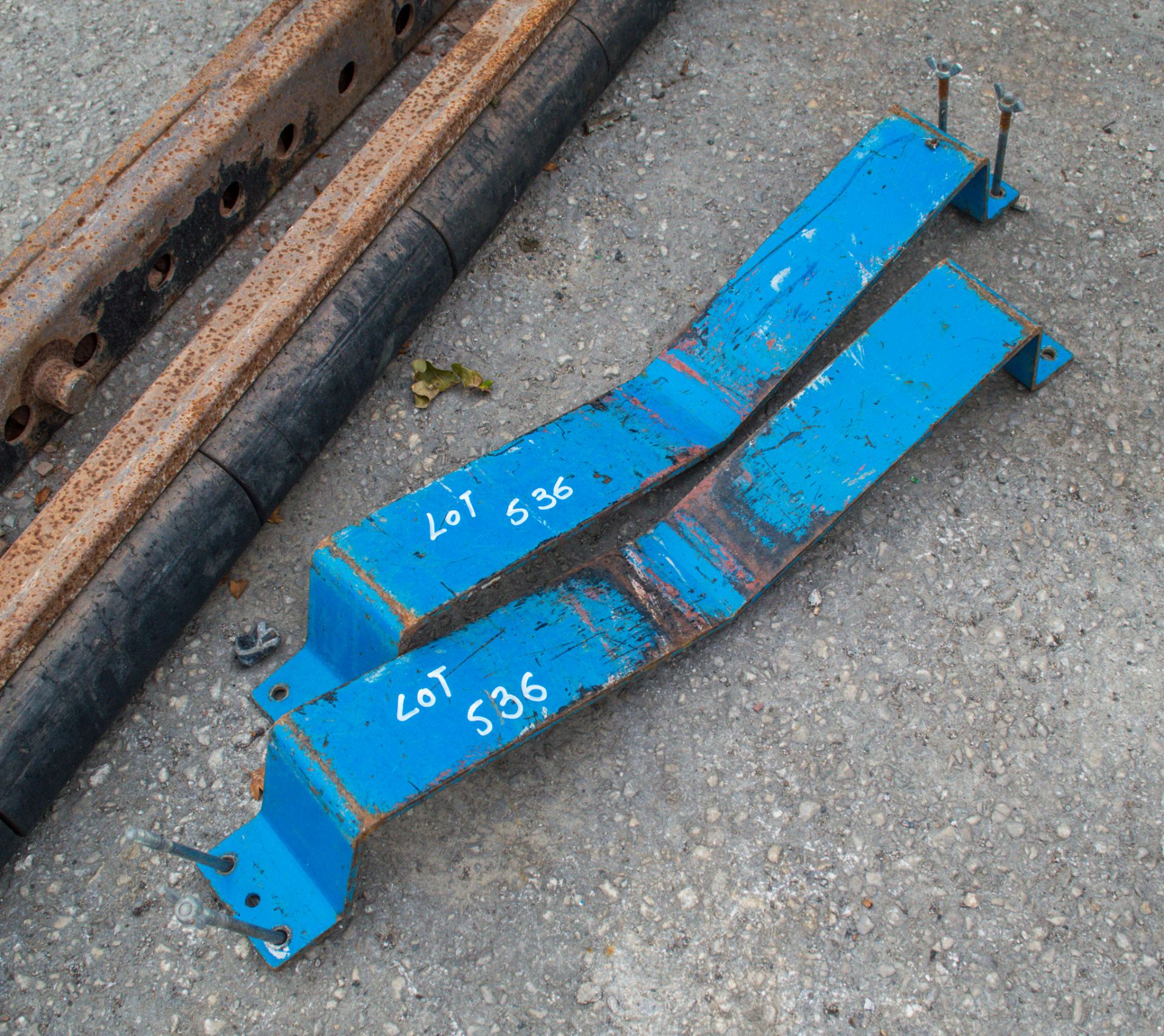 Pair of Genie hoist pipe holder attachments