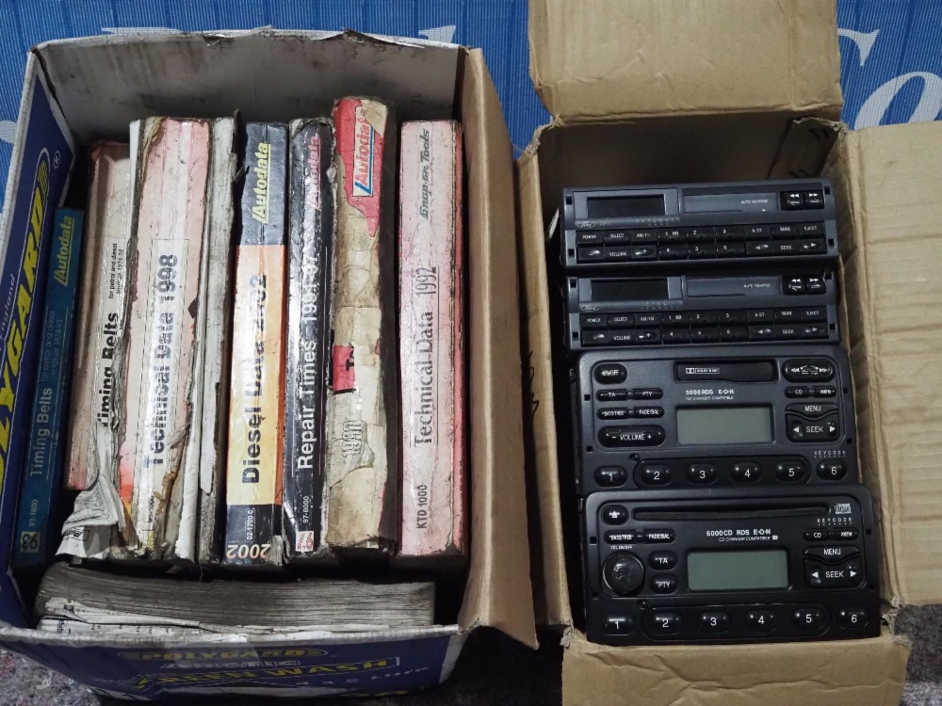 4- Mk5 and Mk6 Ford Escort radios with codes and box of assorted car technical data books