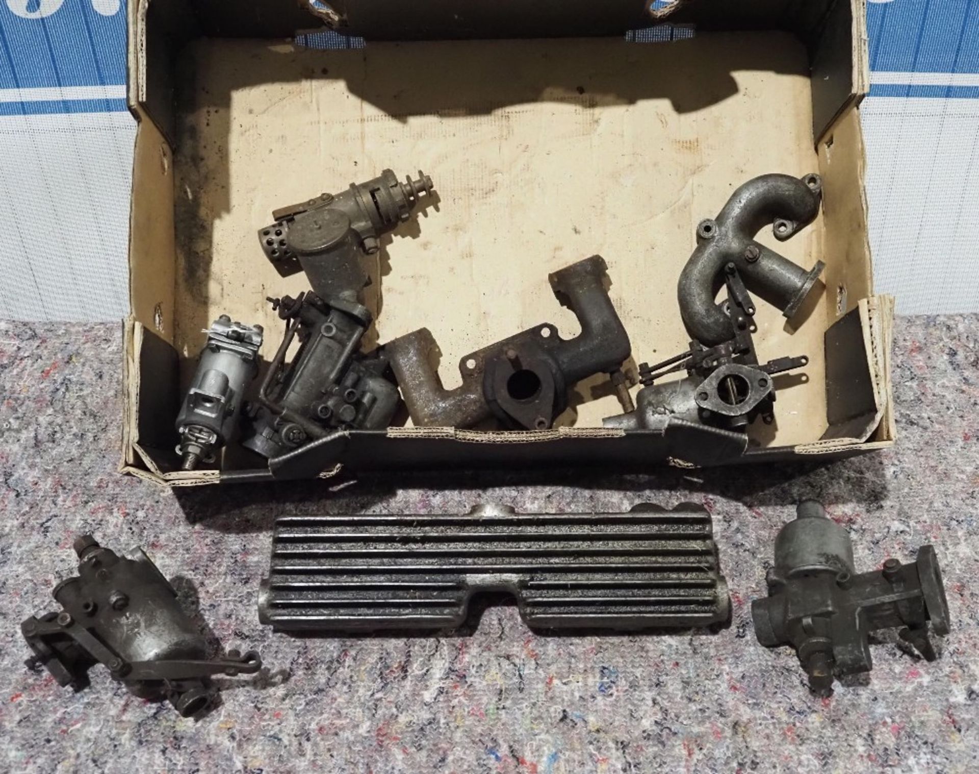 Box of assorted carburettors