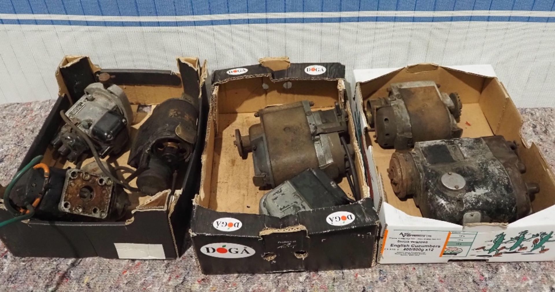 3- Boxes of vintage car magnetos