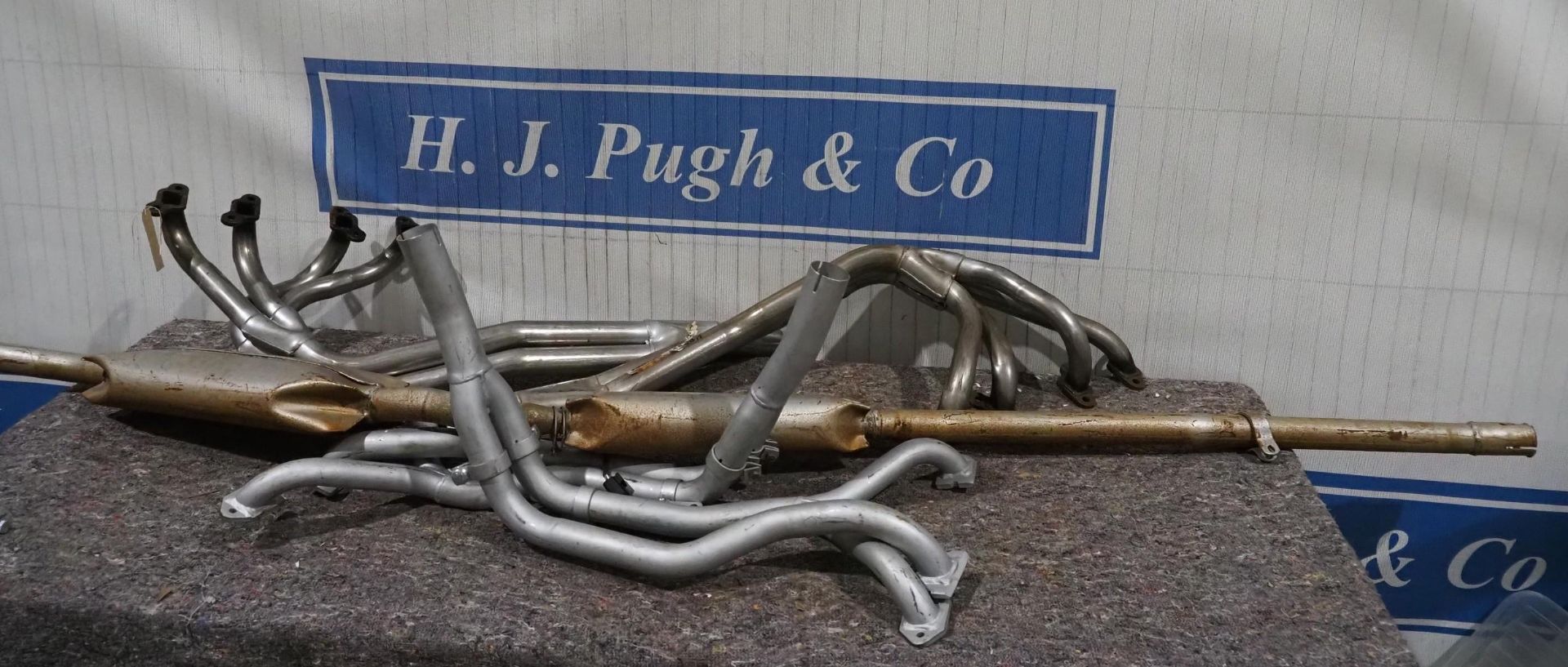 2- Triumph TR7/TR8 stainless steel exhaust manifolds, Austin Mini exhaust and 2 others