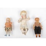 Drei kleine Puppen um 1900