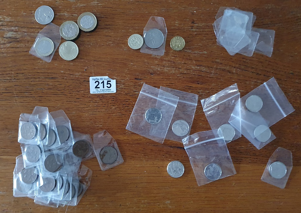 A collection of 25 collectable 2-pence pieces, 4 £1 pieces and 7 10-pence pieces (all in pouches)