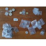 A collection of 25 collectable 2-pence pieces, 4 £1 pieces and 7 10-pence pieces (all in pouches)