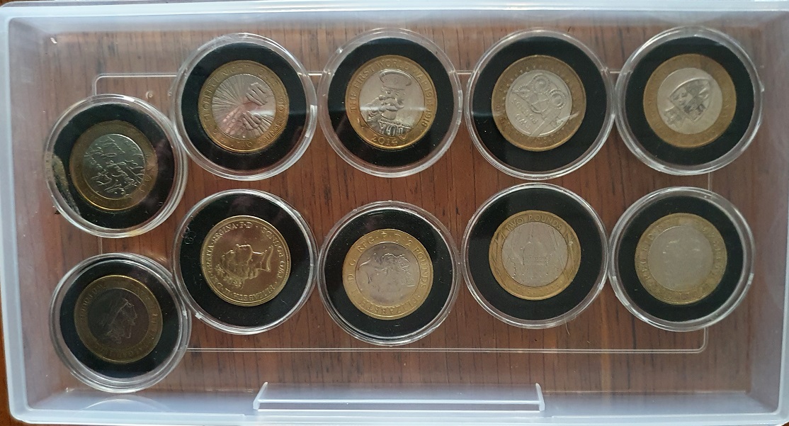 A box containing 10 collectable cased commemorative-design £2 pieces