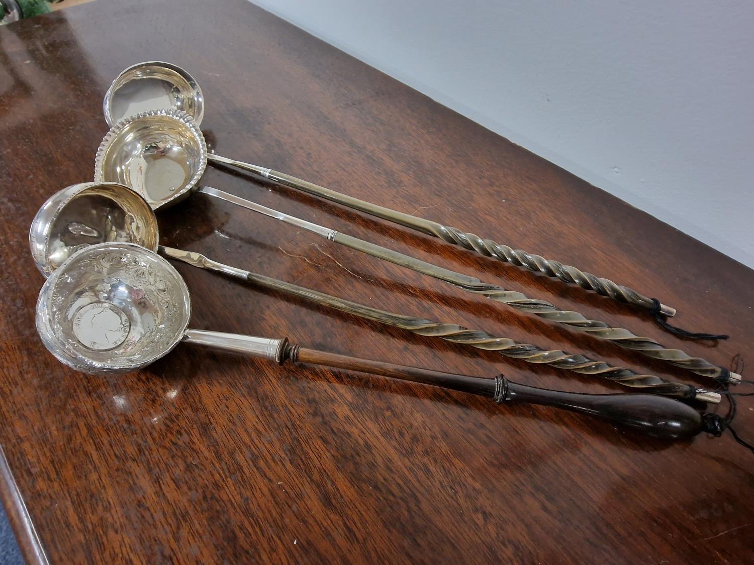 Quartet of Wooden Handled Antique Silver Serving Ladels