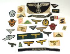 A selection of assorted German Third Reich and later cloth insignia