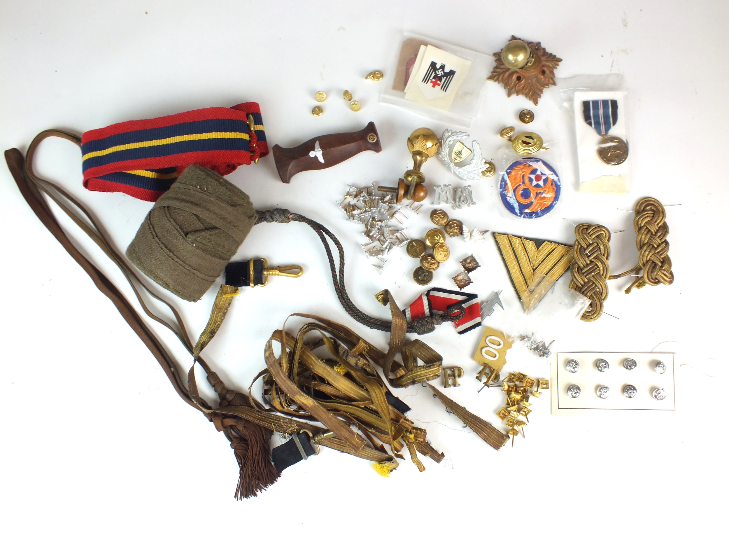 A mixed lot of insignia, uniform and various parts comprising SA Dagger handle, roll of khaki cloth,