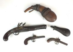 Two percussion pocket pistols, a flintlock pistol and two flasks