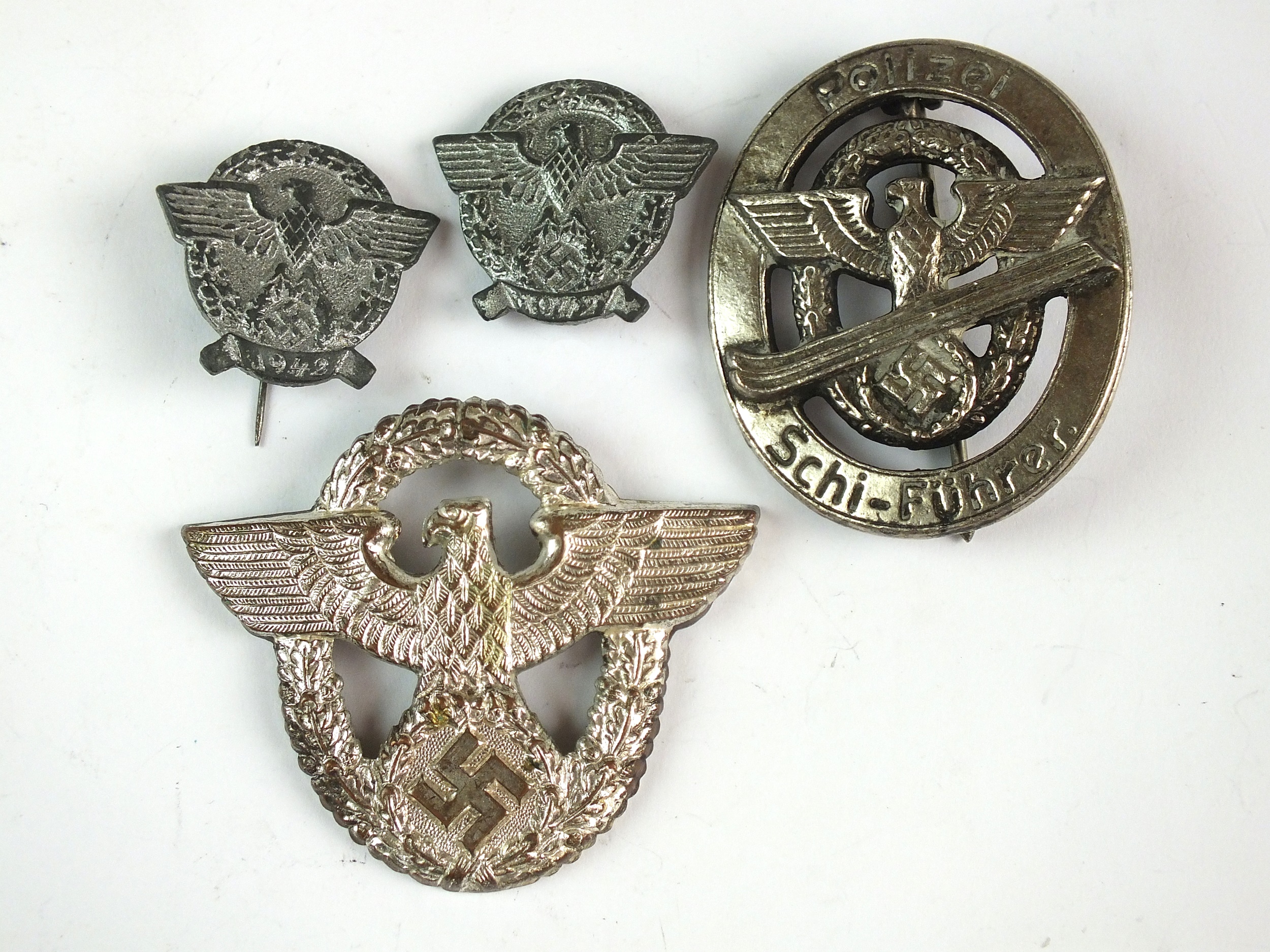 Four German police badges