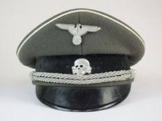 A post-war copy of a German Waffen-SS Officer's visor cap, various stampings to interior.