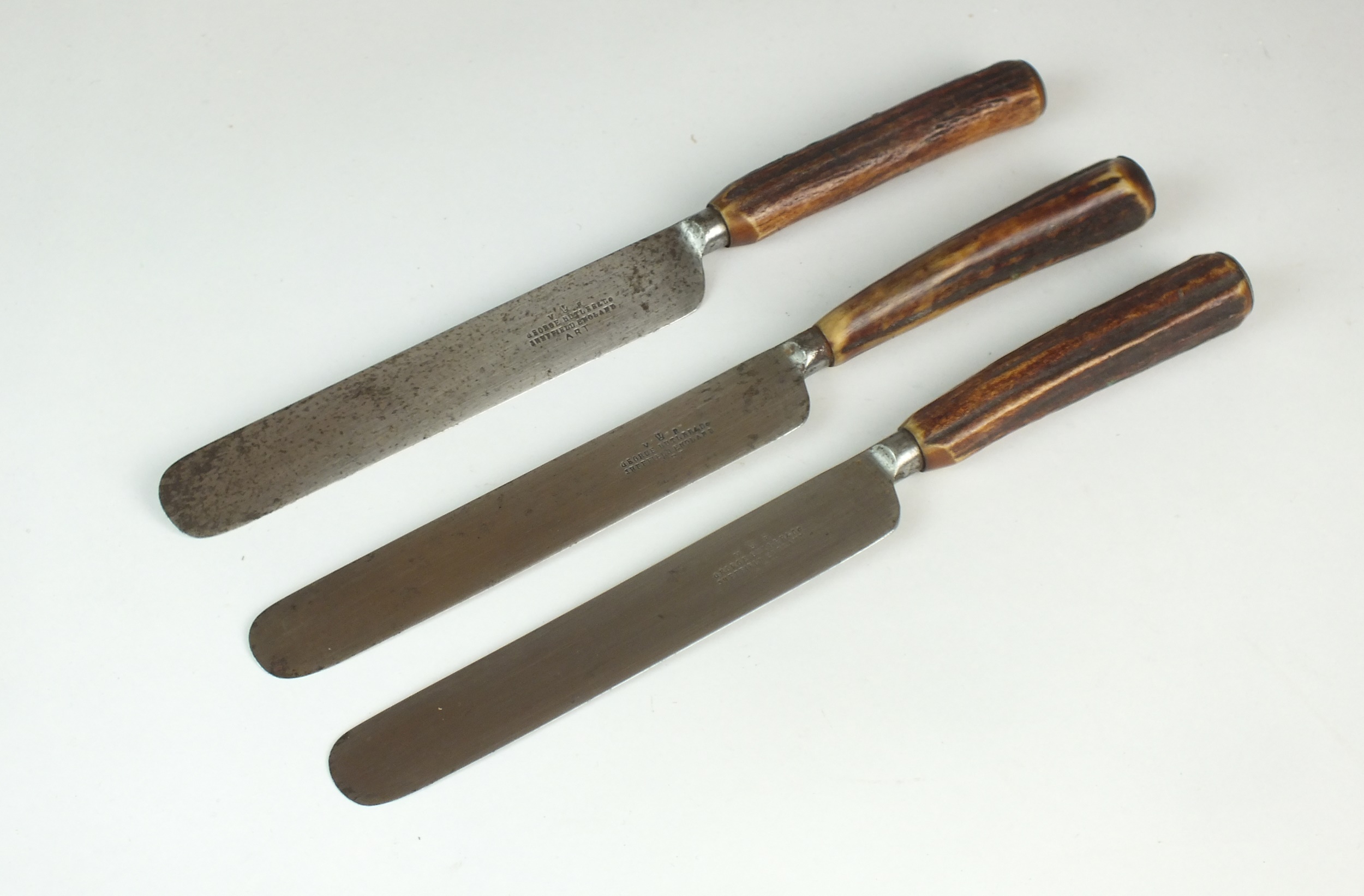 A set of three George Butler & Co Sheffield knives with antler handles, overall lengths 28cm (3)