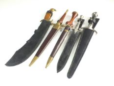 A group of five modern ornamental knives and sheathes, including a Parang (5) PLEASE NOTE ALL BLADED