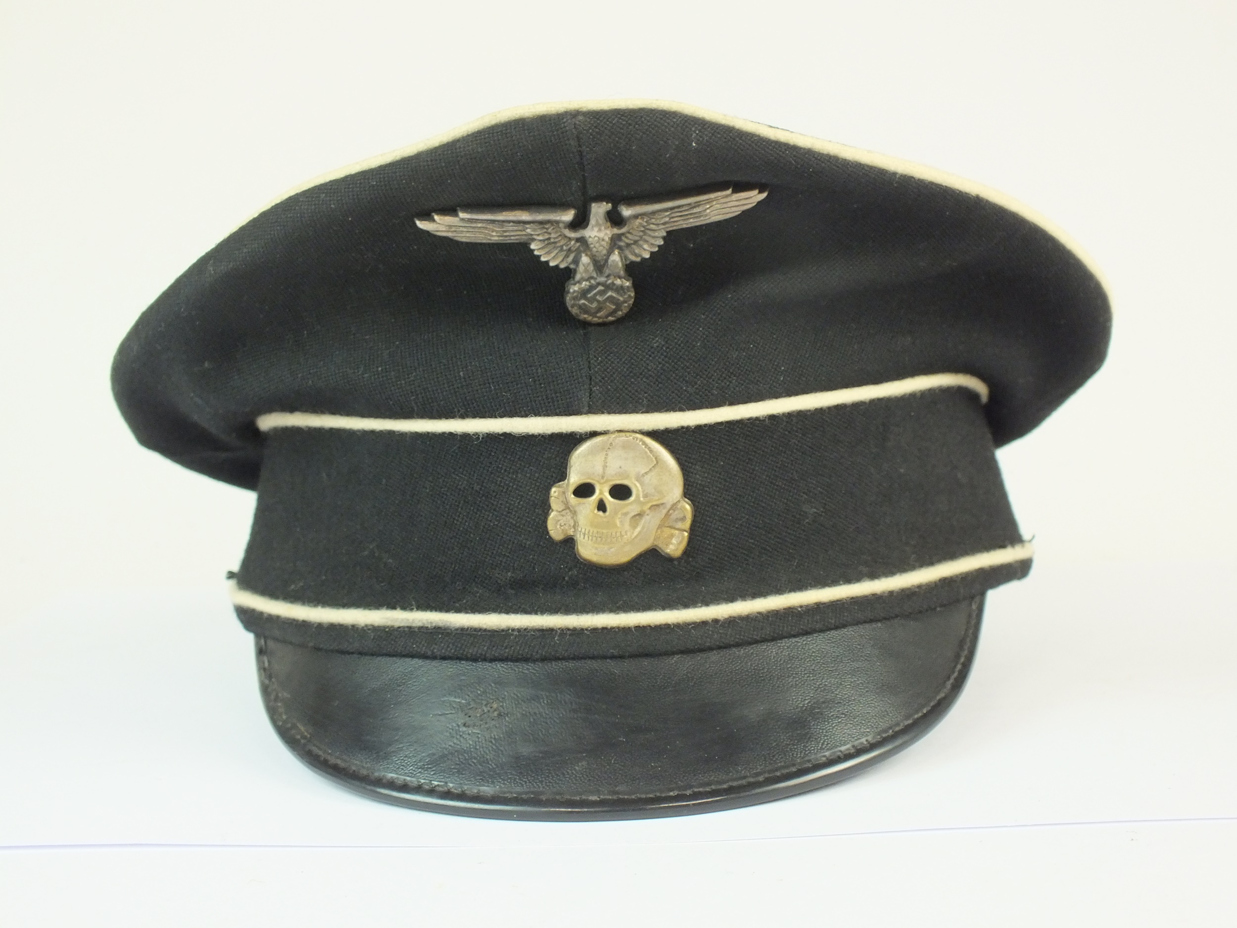 A post-war copy of a German Allgemeine SS visor cap, black ink stampings to interior.