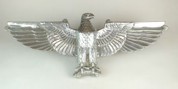 A De-Nazified German cast aluminium wall eagle, possibly post-war, 76cm wide Provenance and notes: