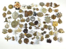 A mixed collection of eighty military badges, mostly British, together with a General pattern belt