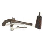 A pistol powder flask by Twigg, with barrel key, oil bottle and a percussion pistol