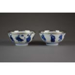 A pair of Chinese blue and white 'immortals' bowls, Kangxi marks and period
