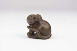 A Japanese wood netsuke of a tiger, Meiji era