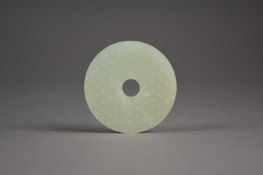 A Chinese pale green jade bi disc, Ming Dynasty