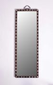A Chinese rosewood-framed wall mirror