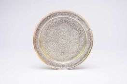 A near Eastern white metal dish, probably Indian