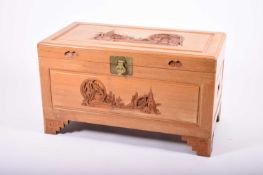A Chinese carved wood, camphor-lined blanket chest