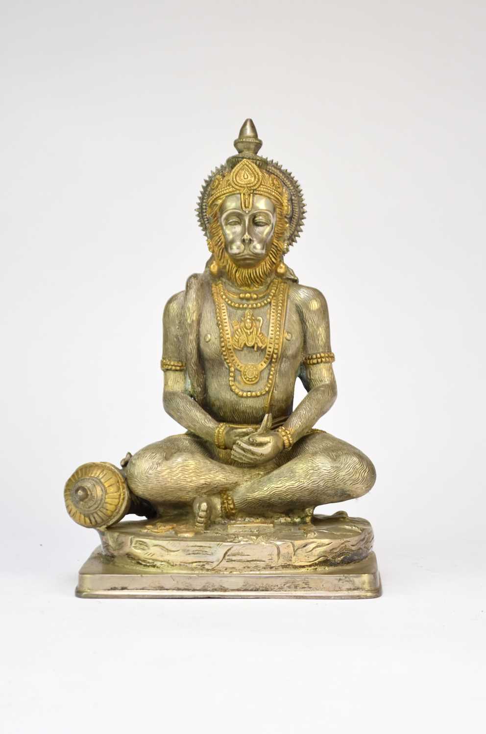 An Indian parcel gilt white metal figure of Hanuman