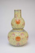 A large Chinese yellow ground famille rose vase, 20th century