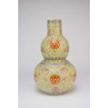 A large Chinese yellow ground famille rose vase, 20th century