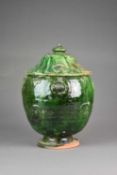 A Chinese green-glazed storage jar and cover, Ming Dynasty