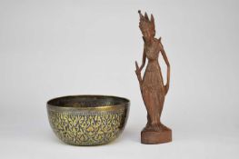 A Sumatra silver niello bowl and Balinese wood figure