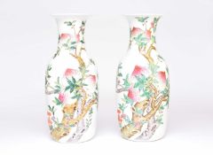 A pair of very large Chinese famille rose 'Nine Peaches' vases