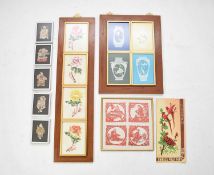 A collection of Chinese cut paper decorations including framed examples