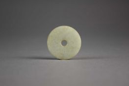 A Chinese pale grey-green jade bi disc, Song Dynasty