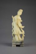 A Chinese carved soapstone figure of Guanyin
