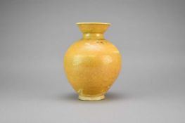 A Chinese porcelaneous ochre glazed jar, probably Tang Dynasty
