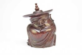 A Chinese carved rosewood figural pot and cover