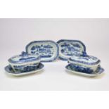 Two Chinese blue and white sauce tureens, covers and four associated stands