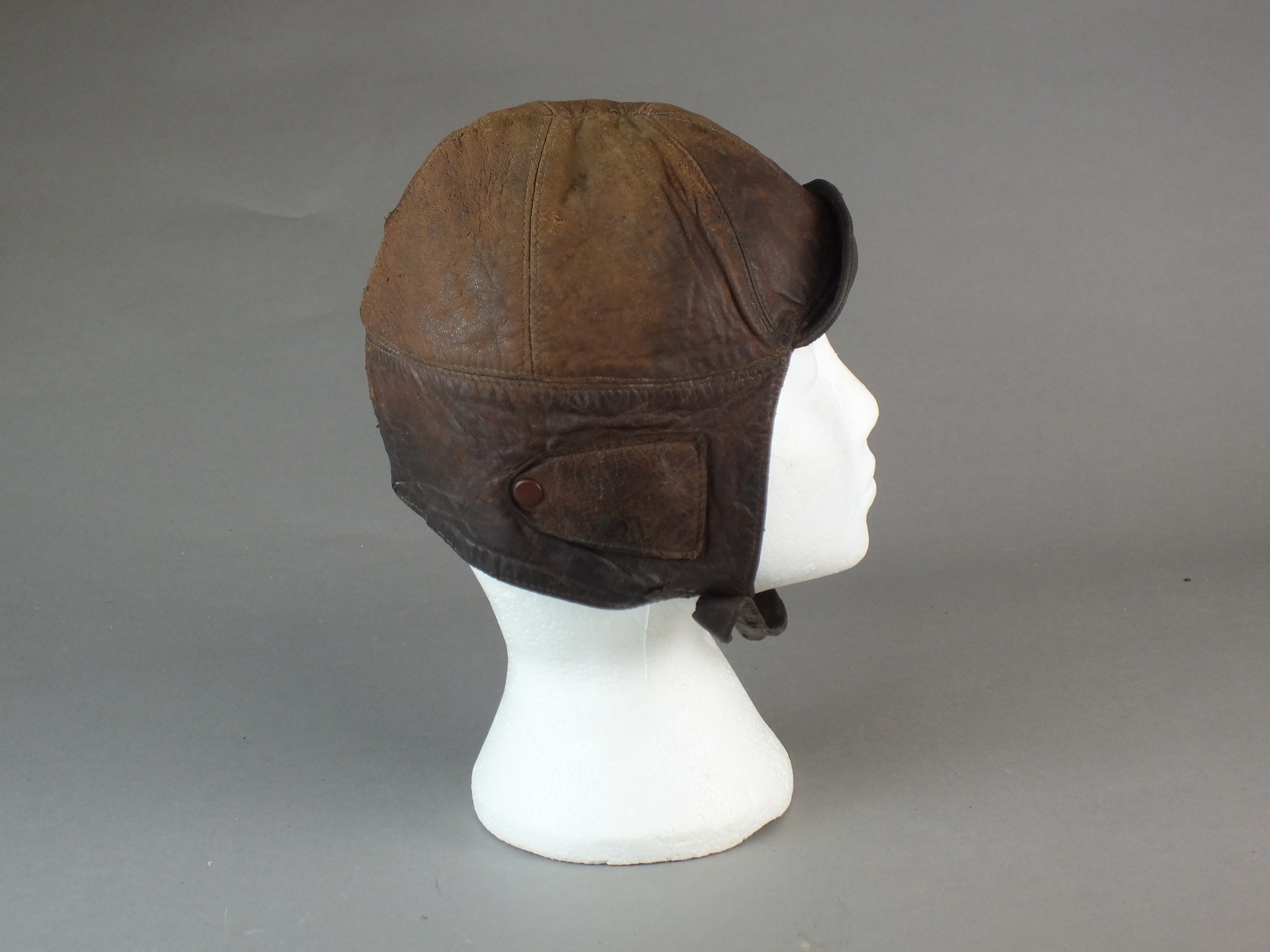 A British early leather Flying Helmet or Motoring helmet, probably WW1-era brown leather with wool- - Image 5 of 6