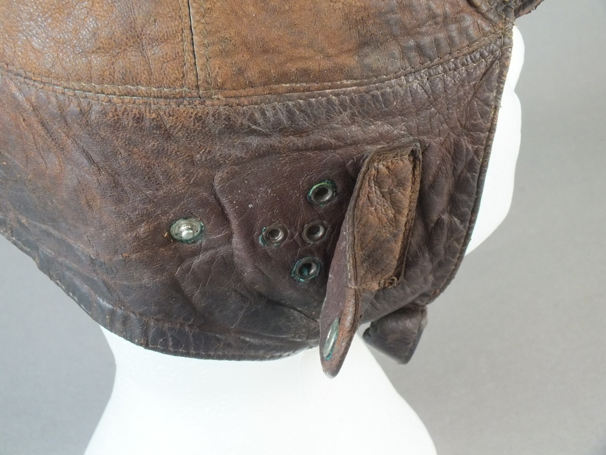 A British early leather Flying Helmet or Motoring helmet, probably WW1-era brown leather with wool- - Image 3 of 6